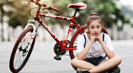 4K Girl On A Bicycle Desktop Wallpaper HD
