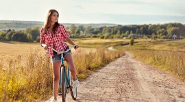 4K Girl On A Bicycle Wallpaper
