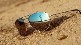 Glasses On Sand Photo Download