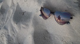 Glasses On Sand Photo Free