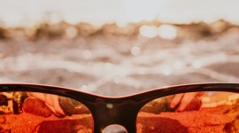 Glasses On Sand Wallpaper For IPhone
